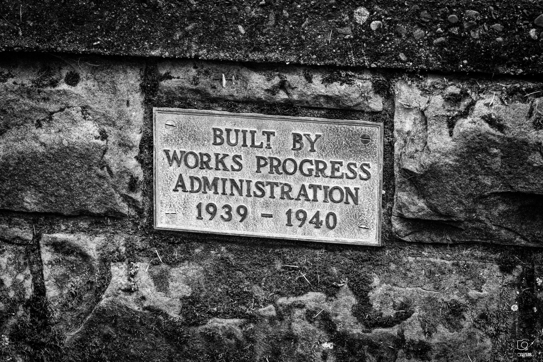 Auto-generated description: A plaque mounted on a stone wall indicates a structure was built by the Works Progress Administration between 1939 and 1940.
